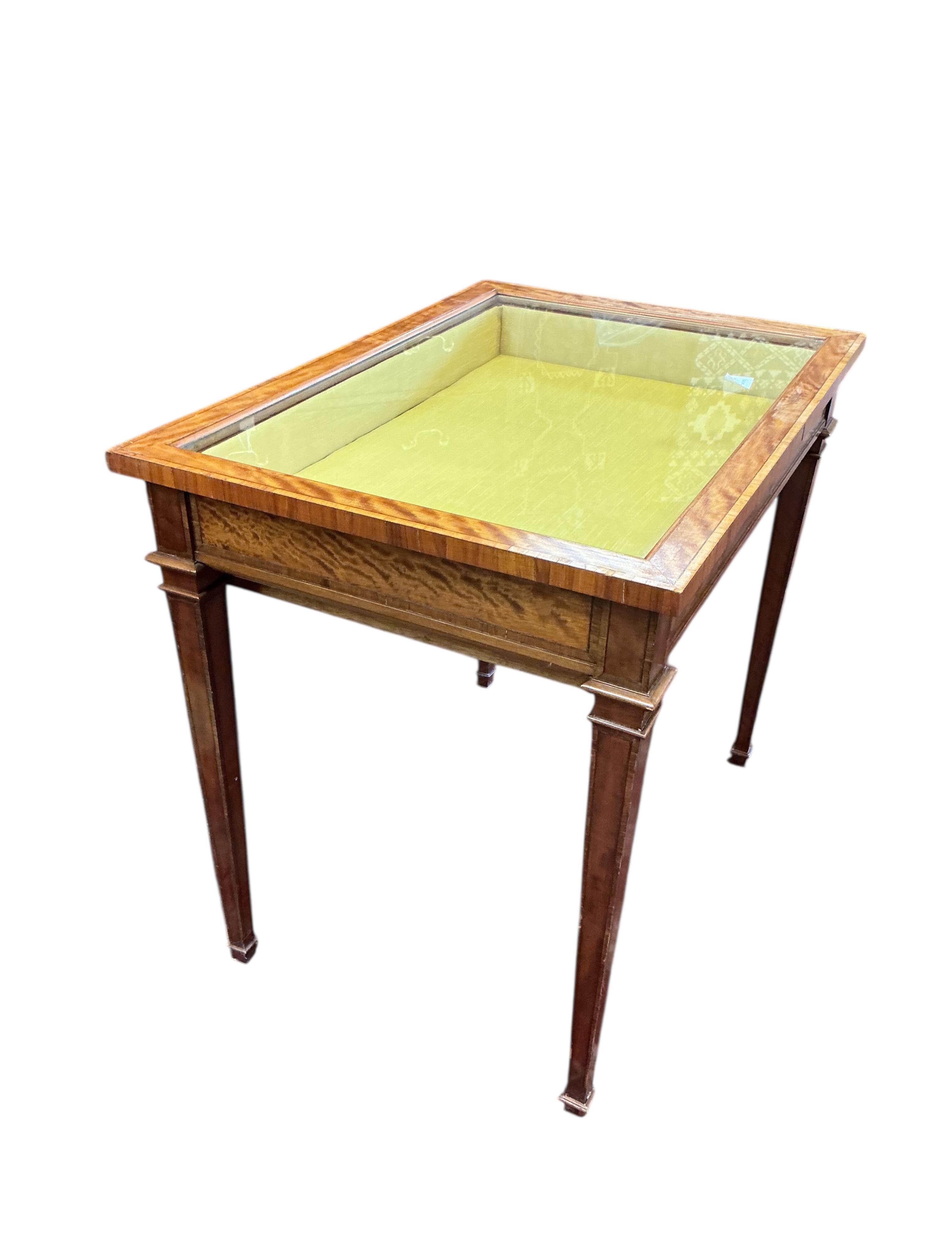 An Edwardian style rectangular satinwood bijouterie table, width 79cm, depth 56cm, height 70cm